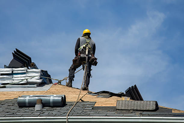 Professional Roof Replacement technician working in Chester, WV